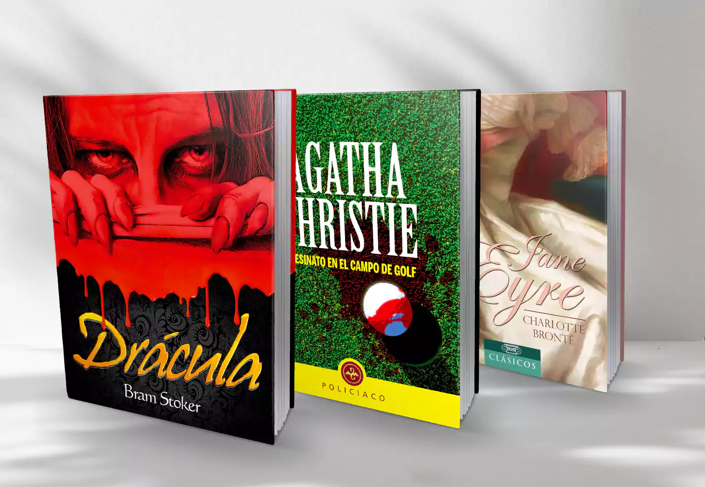 Tres libros de tapa dura. Drácula, Asesinato en el campo de golf y Jane Eyre.